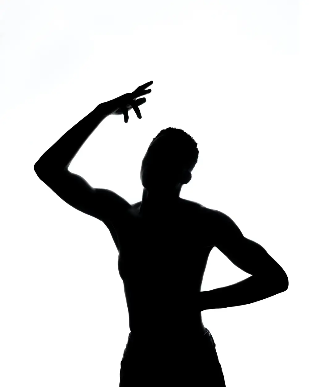 silhouette of a muscular young man