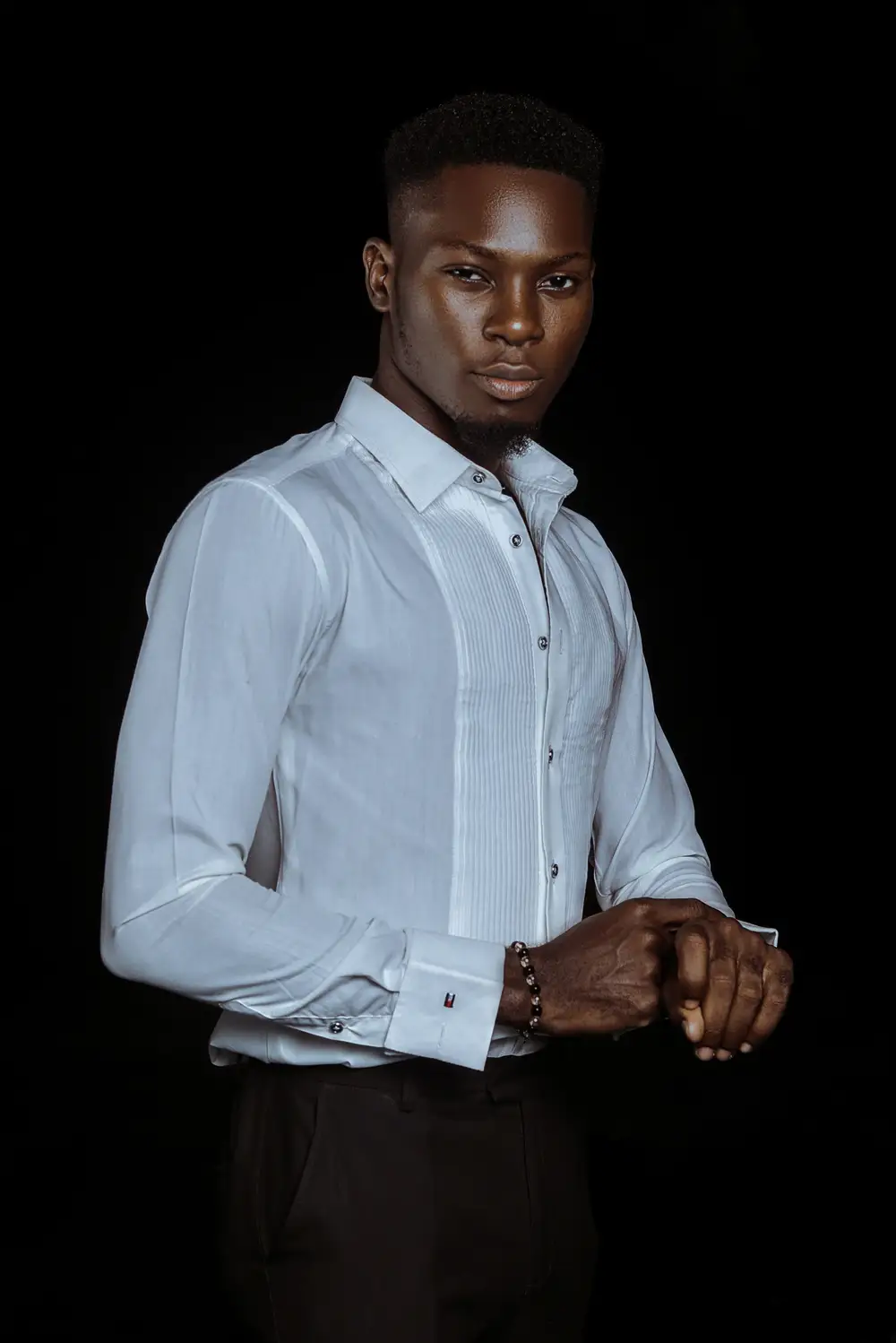 Cute black african nigerian model wearing expensive white shirt