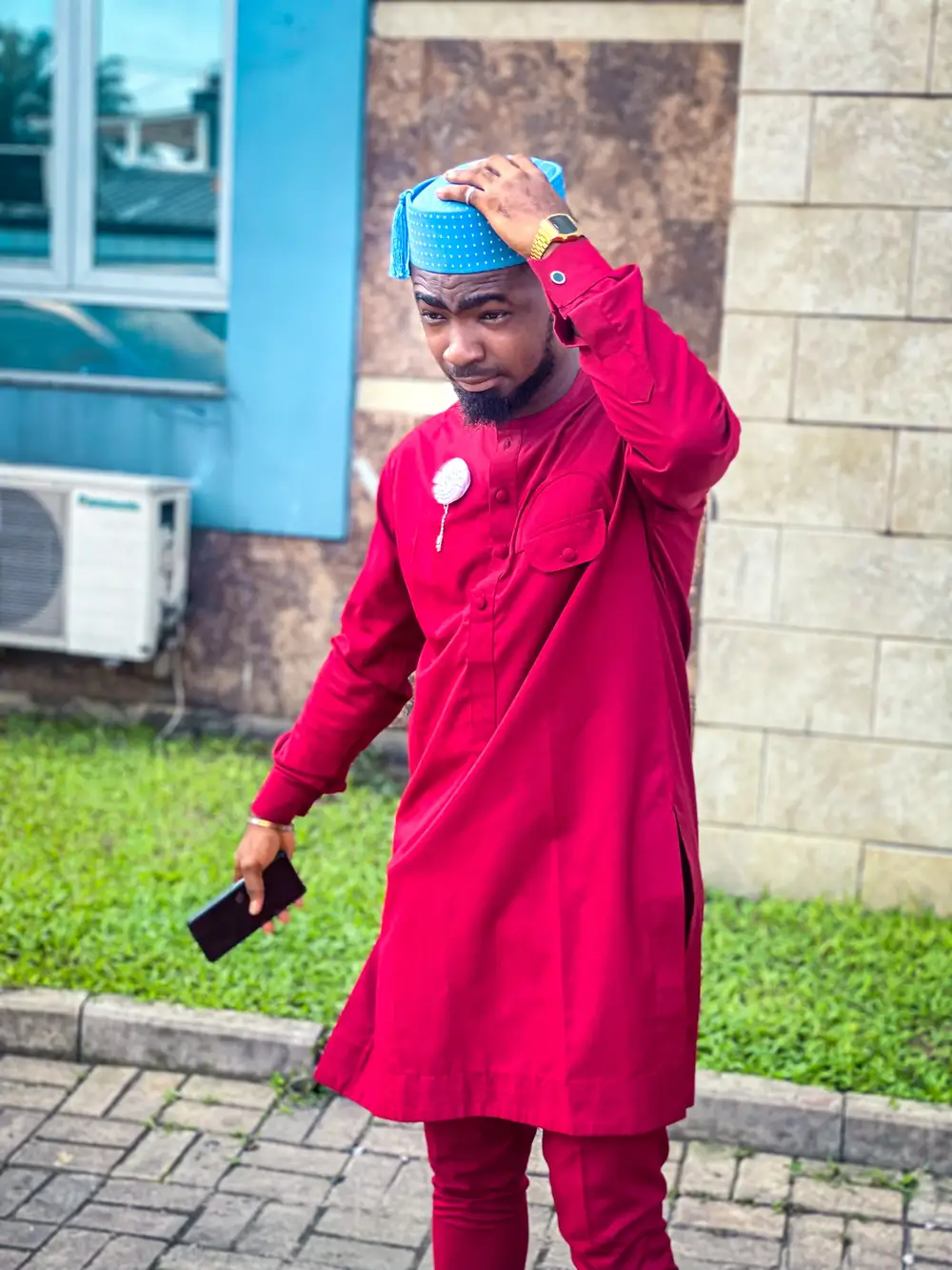Man wearing Red traditional attire