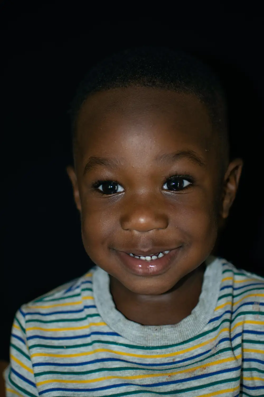 Portrait of toddler smiling.