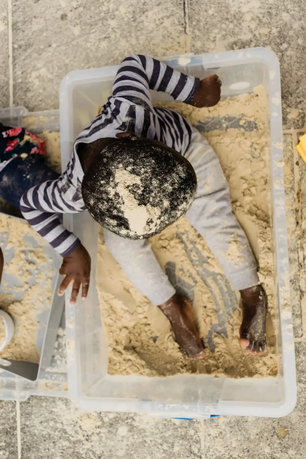 Child playing in a sand box