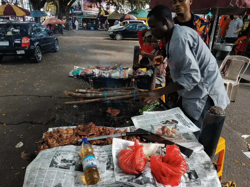 Street Vendor selling Suya