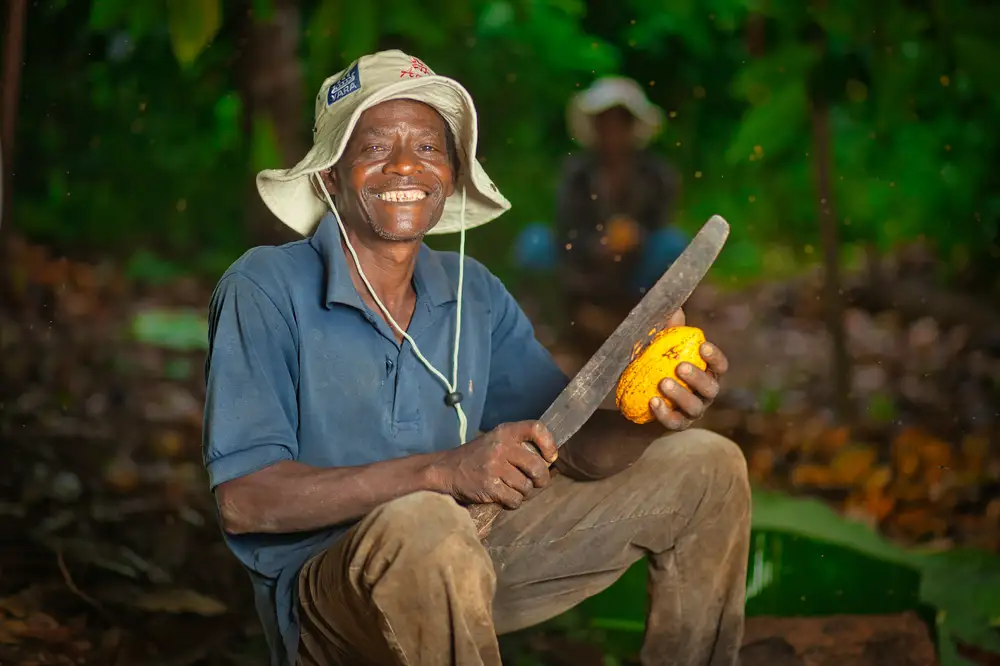 A farmer posing for picture