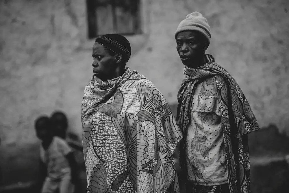 man and woman covering their body