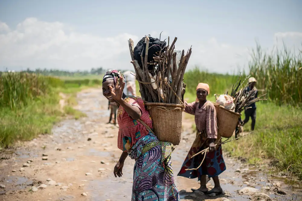 farmersm carrying loads