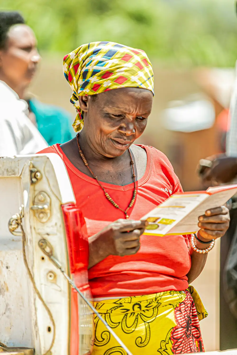 woman reading a booklet