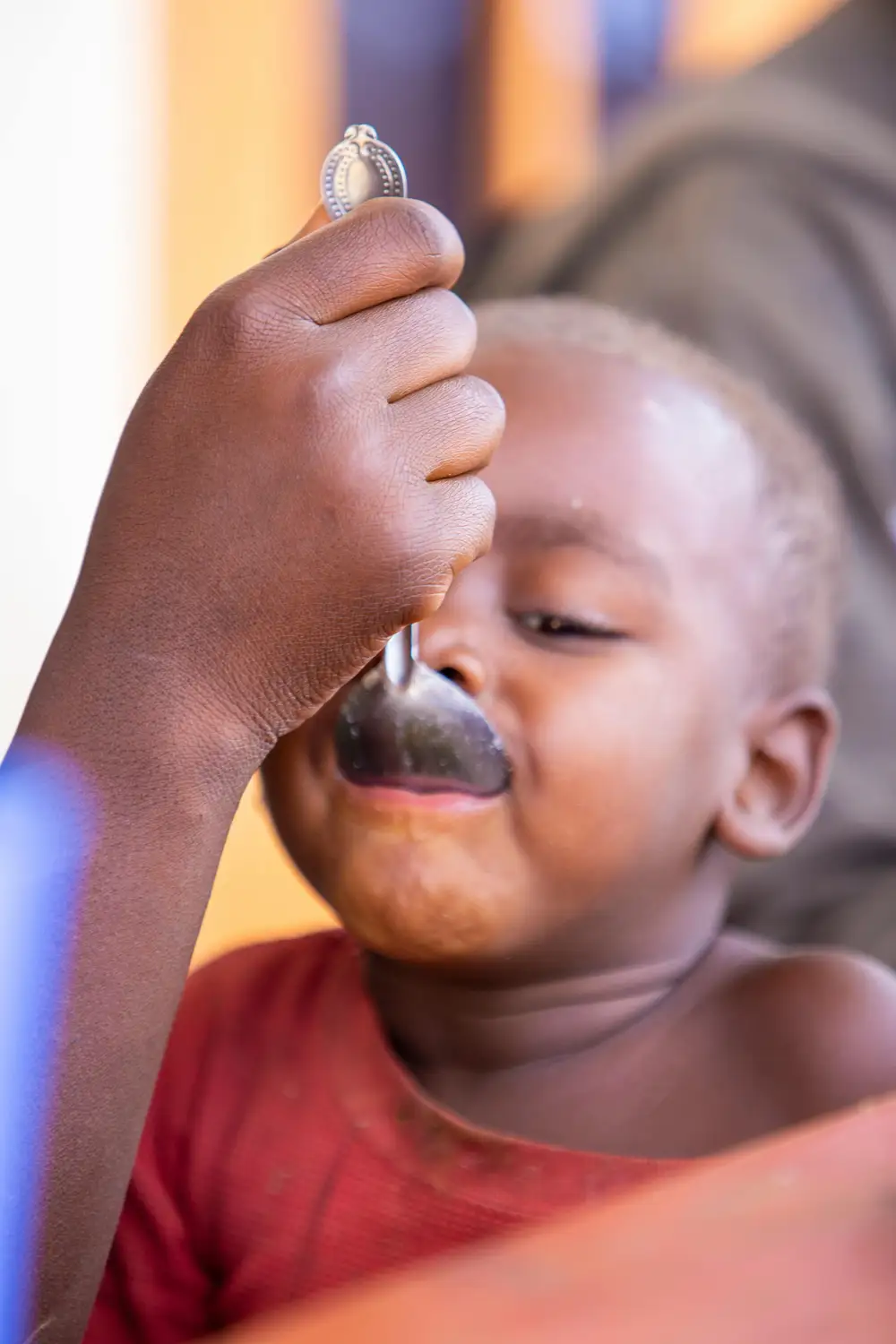 woman feeding a baby