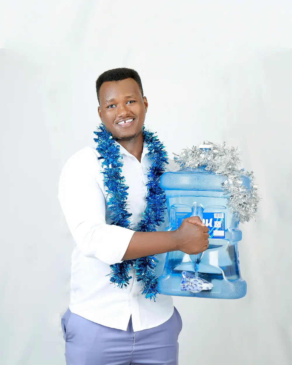 man holding jibu water