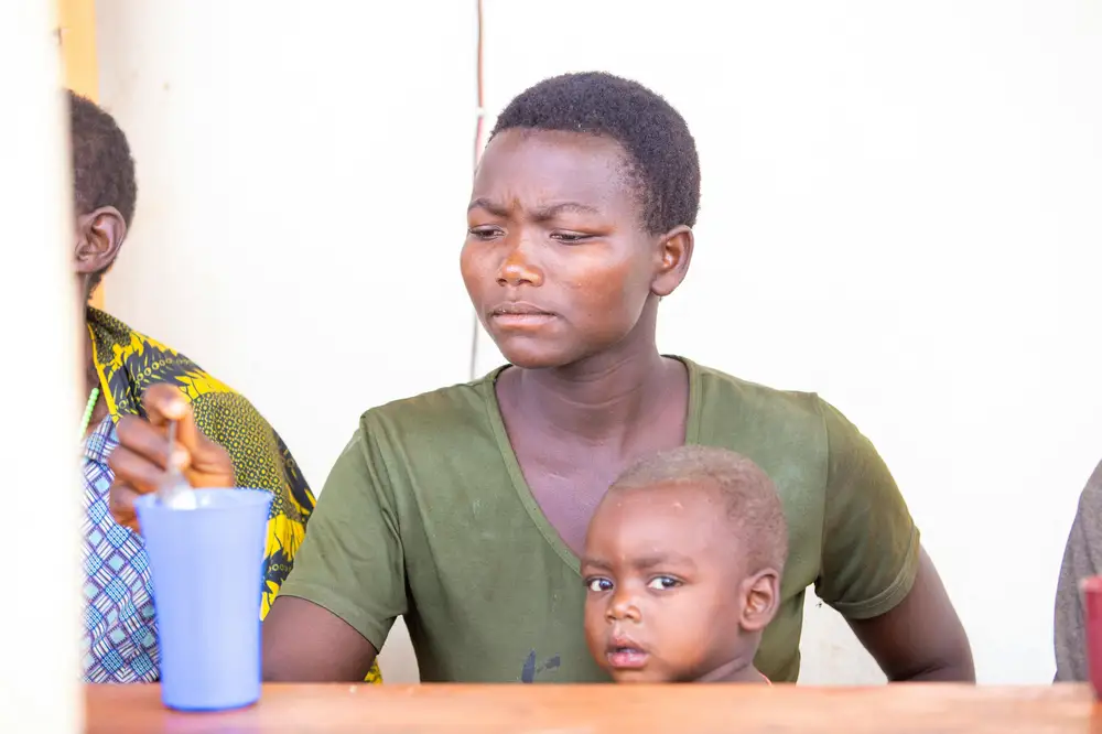 woman feeding a baby