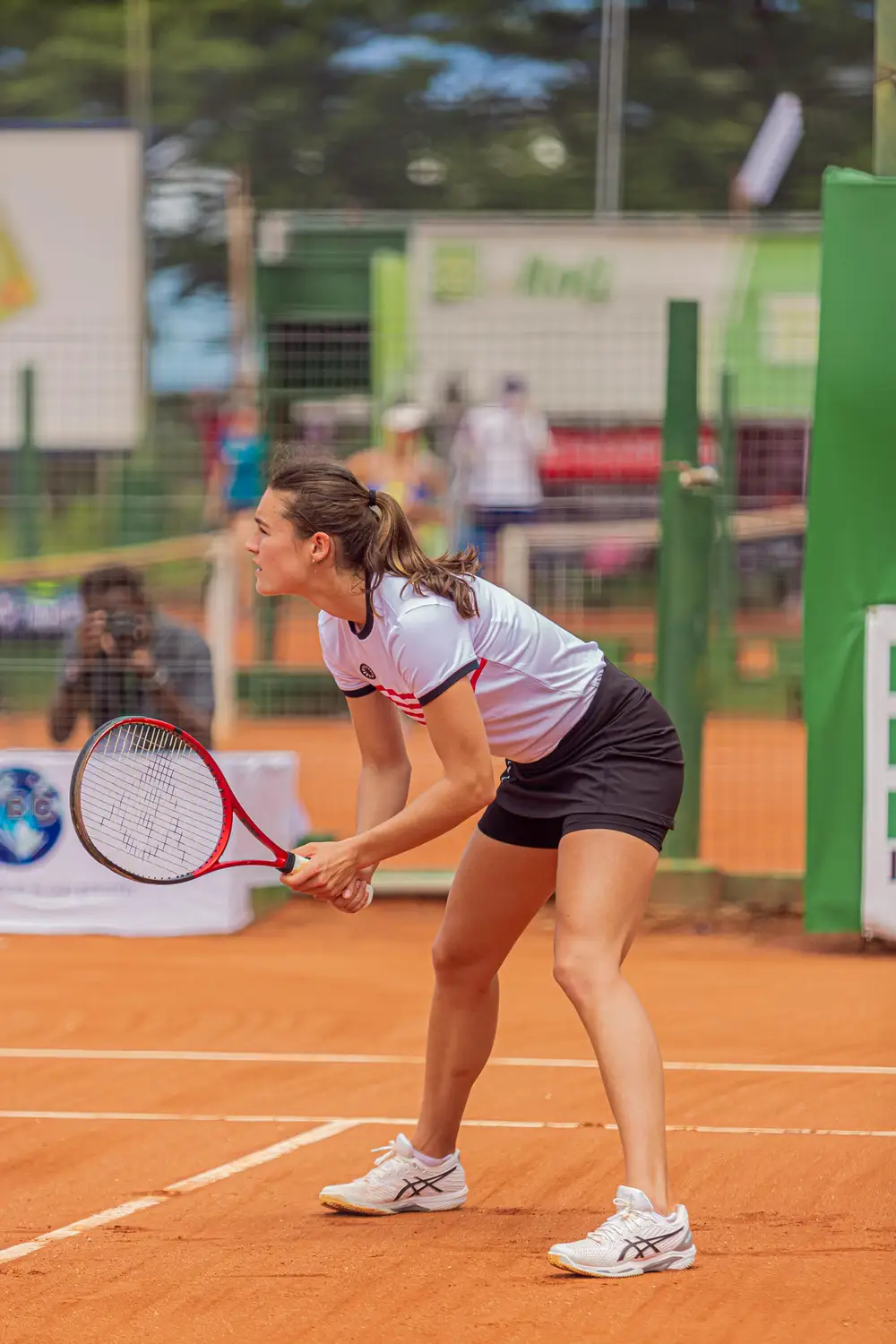 woman playing long tennis