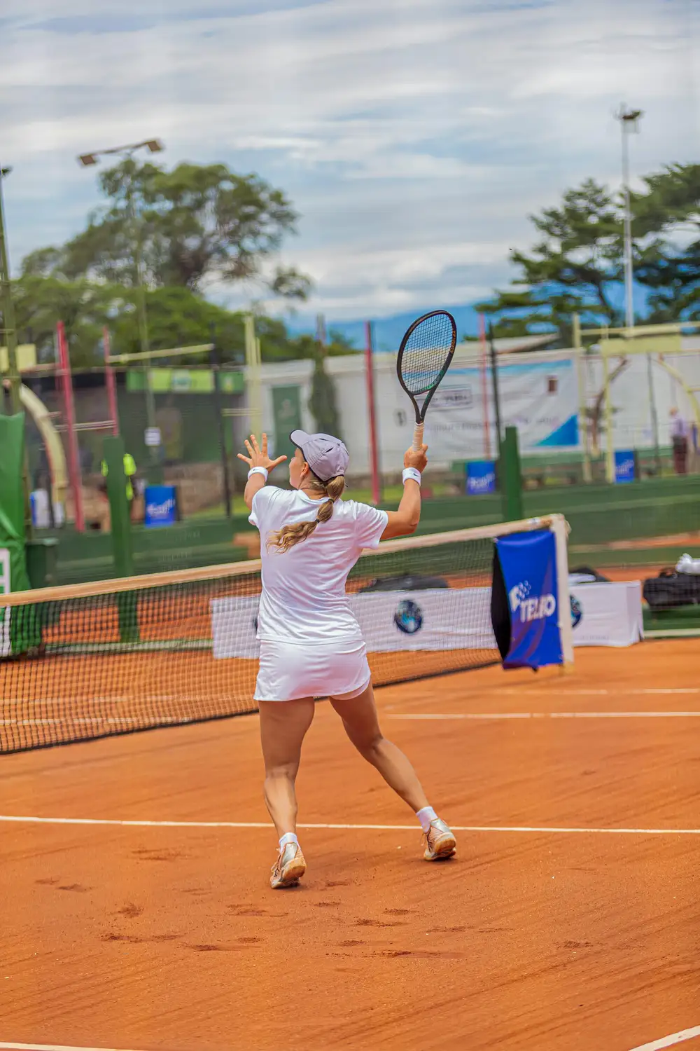 woman playing long tennis
