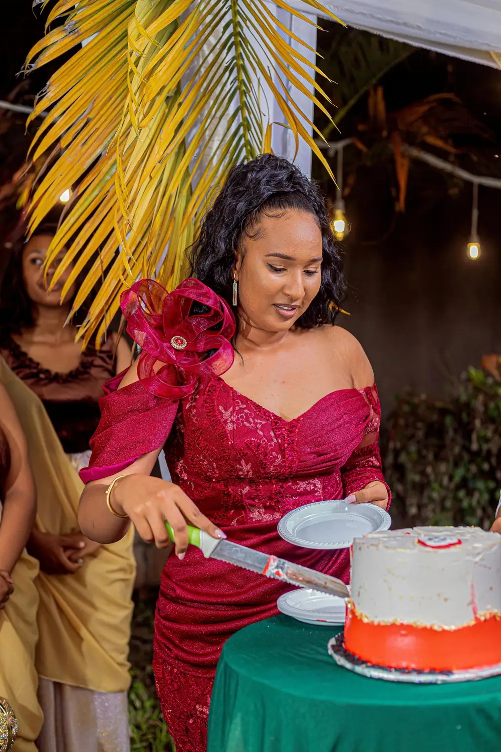 a beautiful woman cutting cake