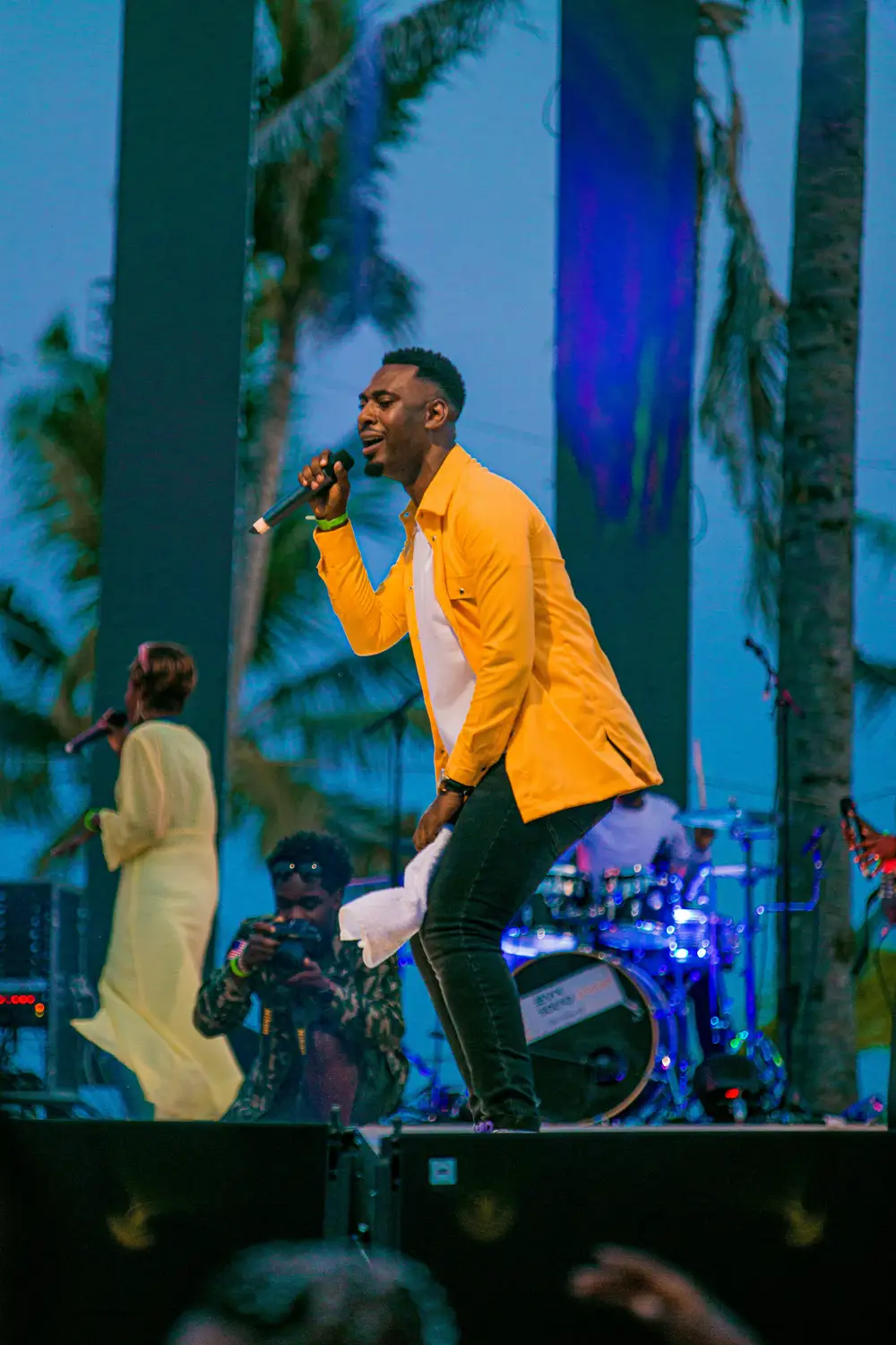 a man singing on stage