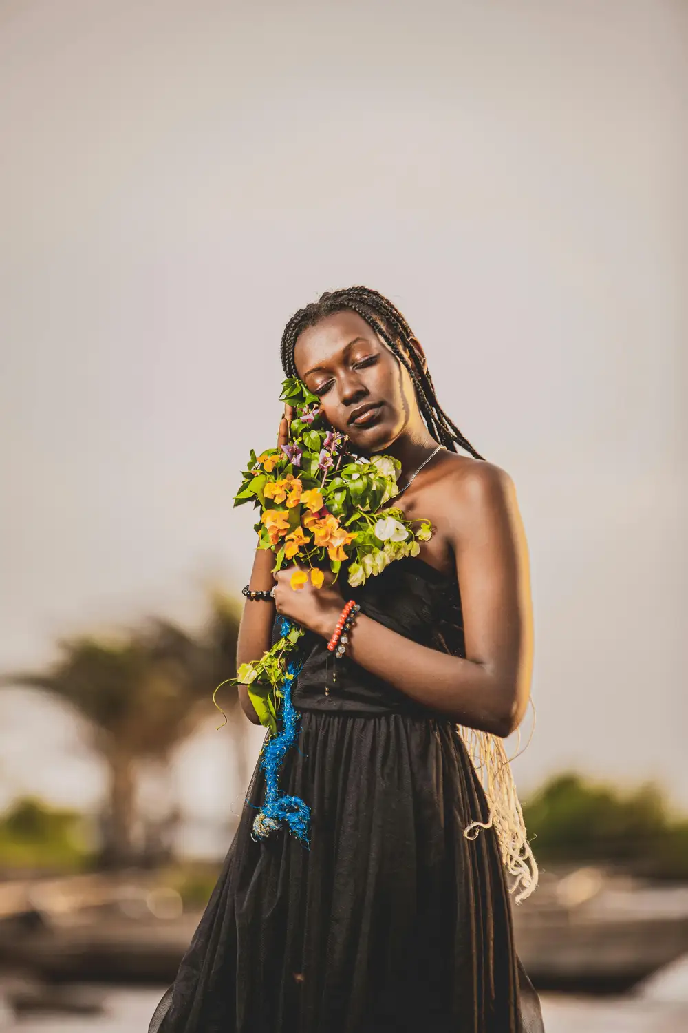 woman holding a flower