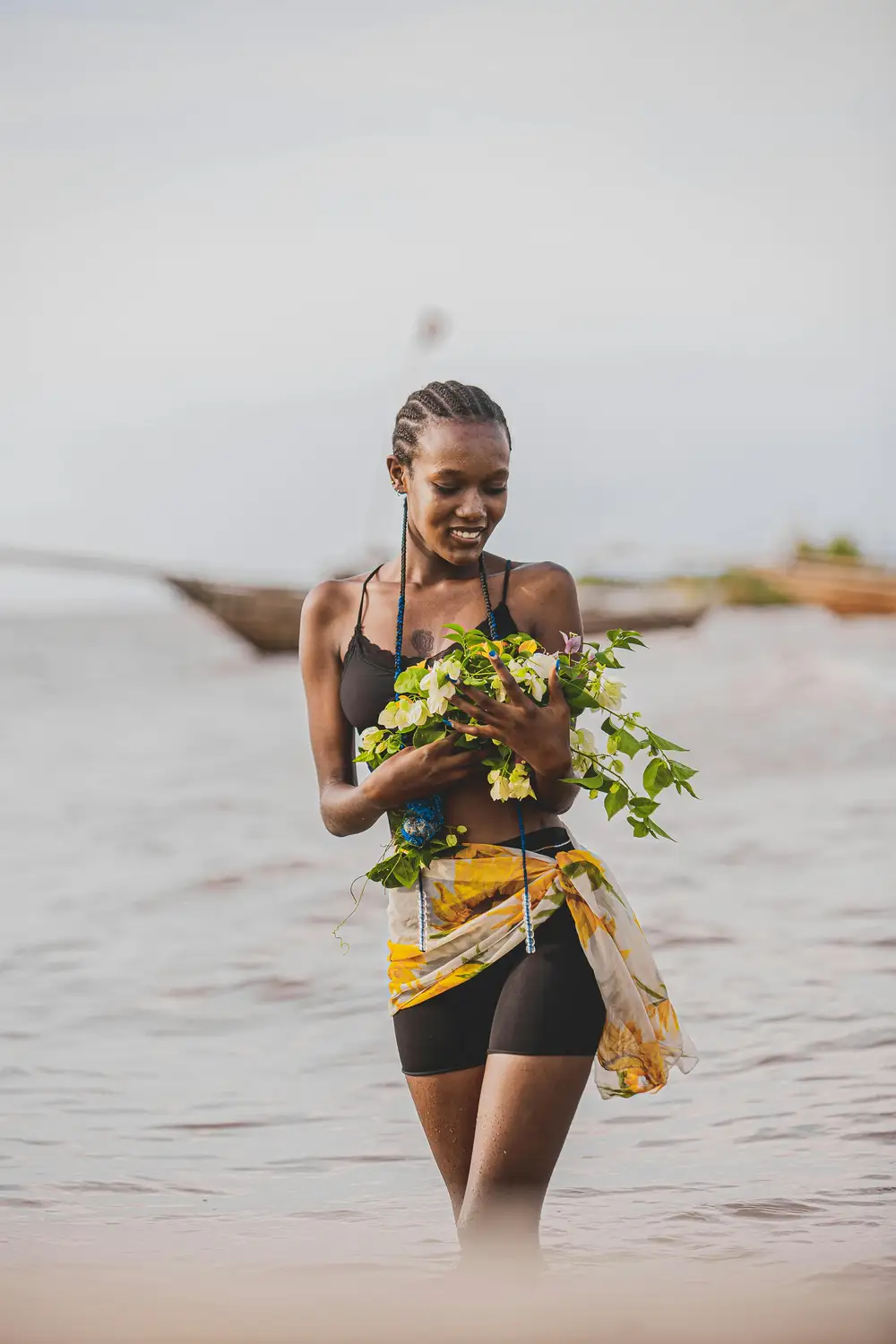 woman holding a flower