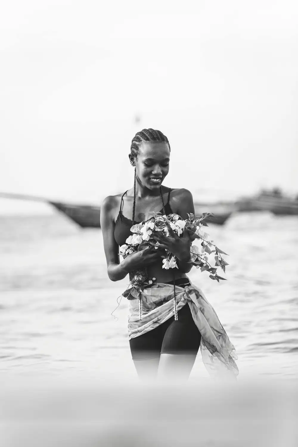 beautiful black lady holding a flower