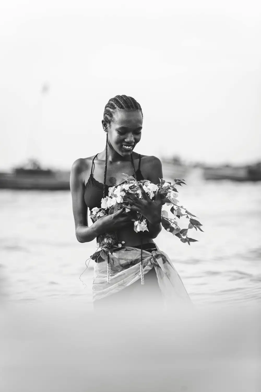 beautiful black lady holding a flower