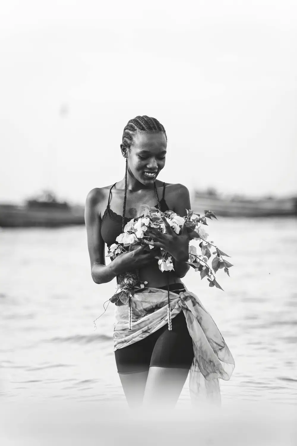 beautiful black lady holding a flower