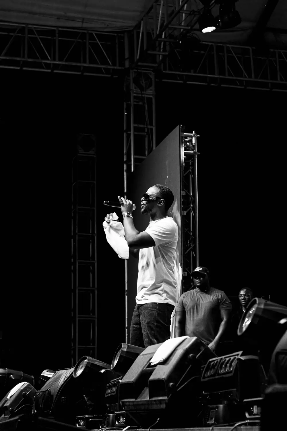 man singing on stage