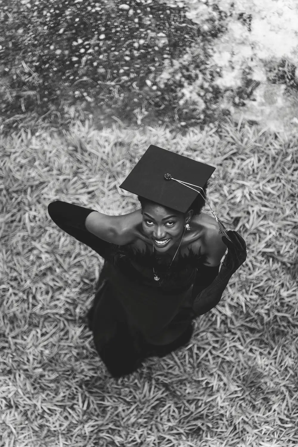 lady on her graduation gown smiling