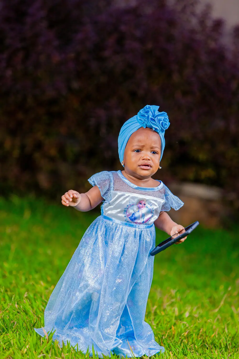 baby girl on blue dress