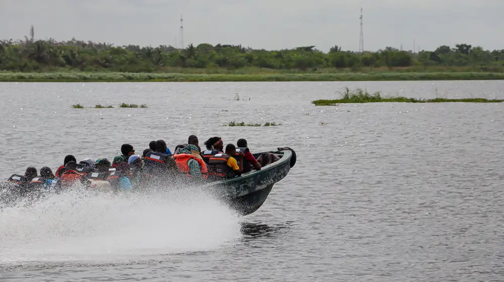 Passengers on a speed boat heading to Seme border
